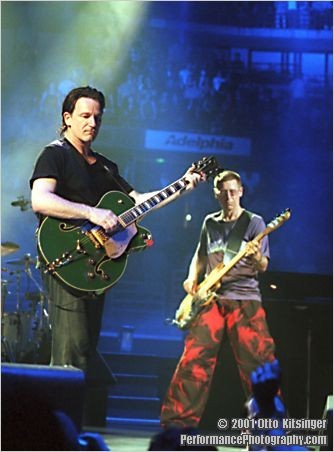 Live concert photo of Bono, Adam Clayton