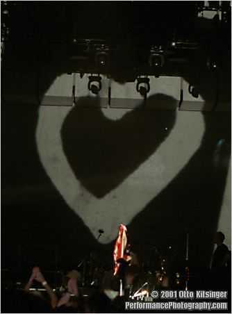Live concert photo of flag jacket and heart (inside suitcase)