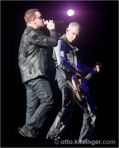 Live concert photo of Bono, Adam Clayton