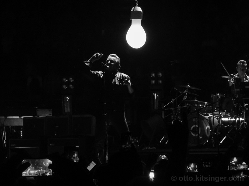 Live concert photo of Bono, Larry Mullen Jr