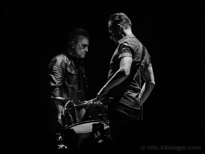 Live concert photo of Bono, Larry Mullen Jr