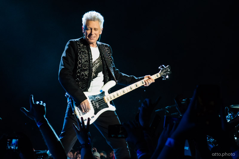 Live concert photo of Adam Clayton